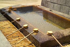 Purification pool next to a Shinto shrine.